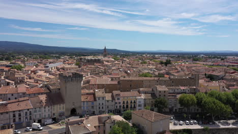 Gate-of-Orange-Carpentras-Vaucluse-Provence-France-aerial-view-over-the-city-sun
